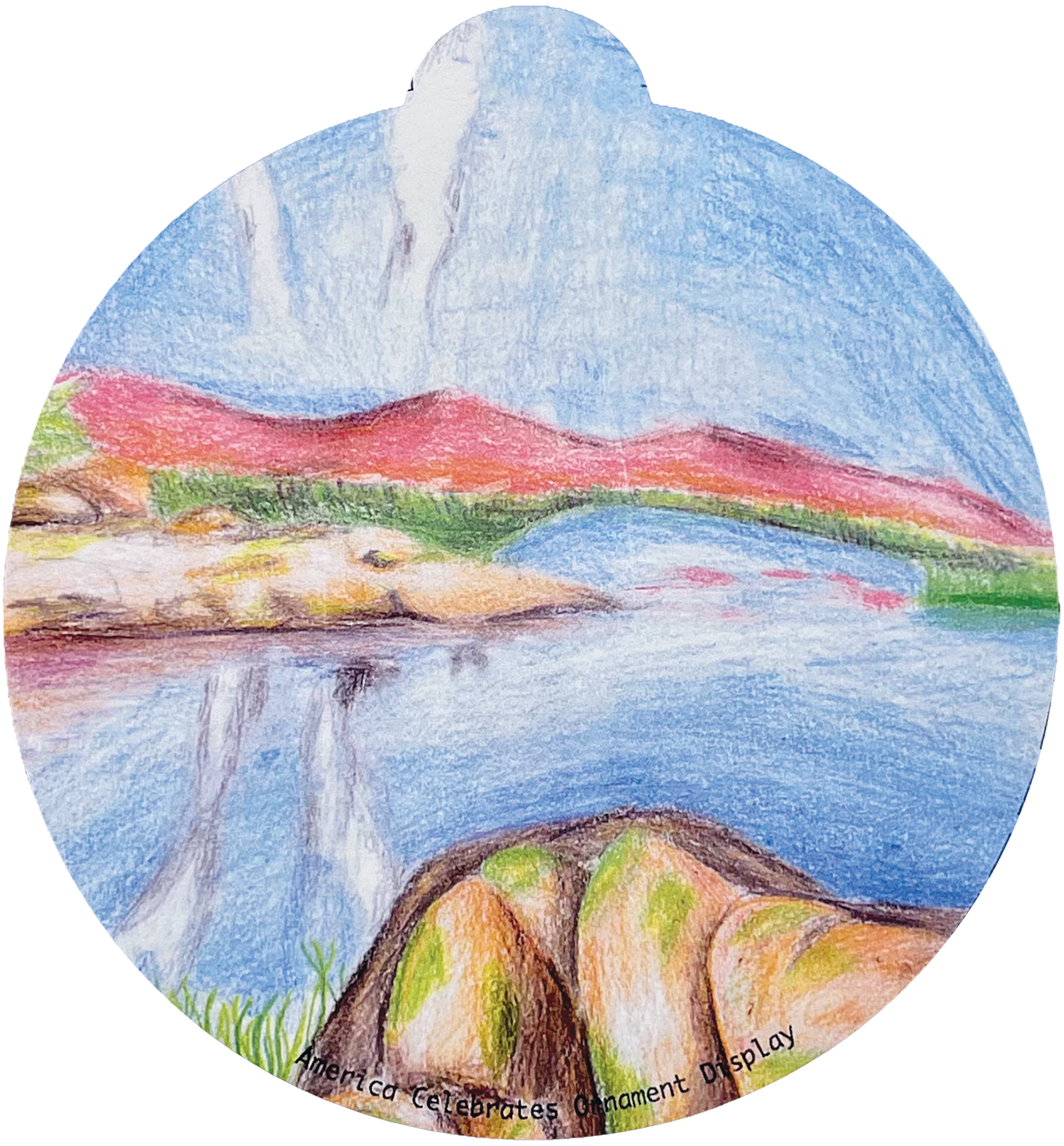 ornament depicting a body of water surrounded by technicolor mountains