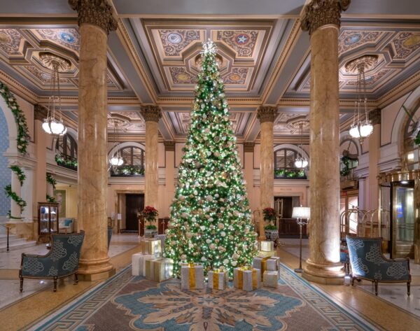 Willard Hotel lobby with towering Christmas Tree with gift underneath